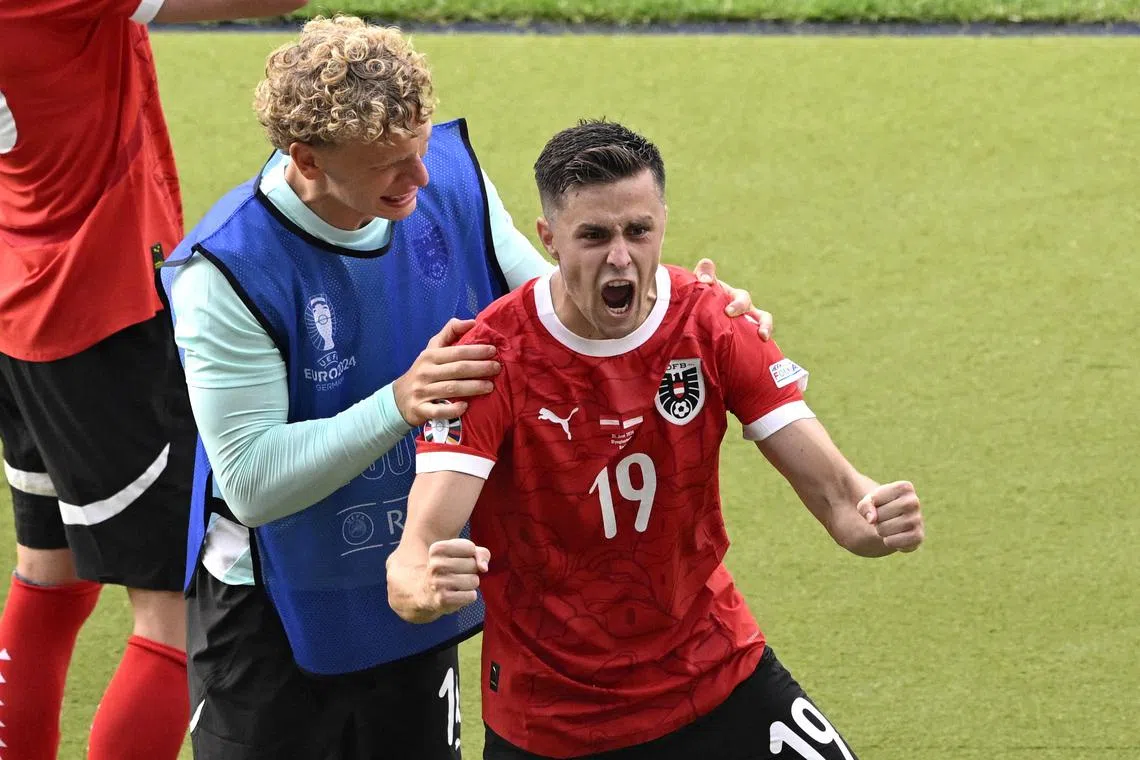 Soccer Football - Euro 2024 - Group D - Poland v Austria - Berlin Olympiastadion, Berlin, Germany - June 21, 2024 Austria's Christoph Baumgartner celebrates scoring their second goal REUTERS/Fabian Bimmer