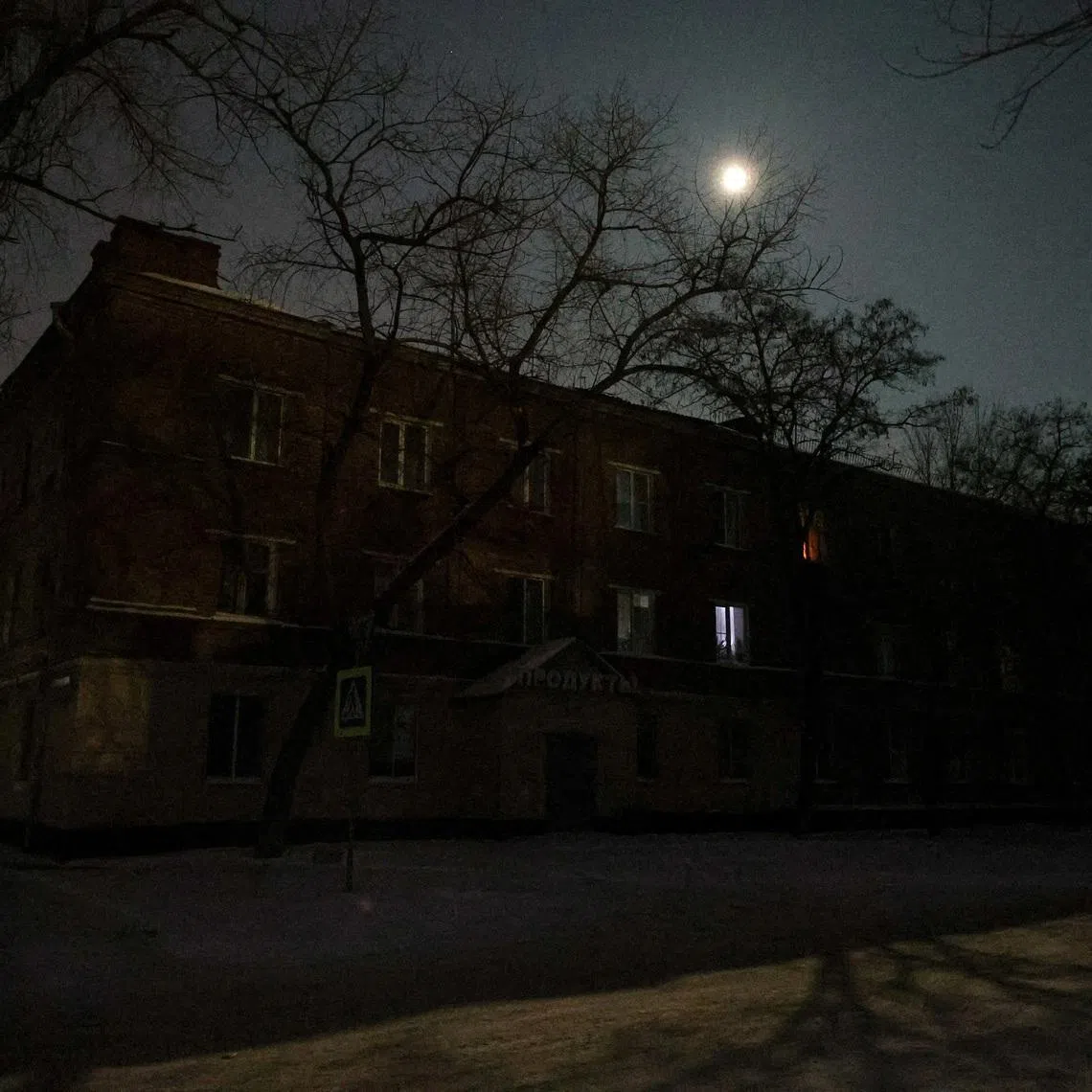 Residential buildings during a power blackout, that according to local authorities was caused by a recent Ukrainian missile attack targeting the regional energy system, amid the Russia-Ukraine military conflict in Belgorod, Russia. REUTERS/Stringer