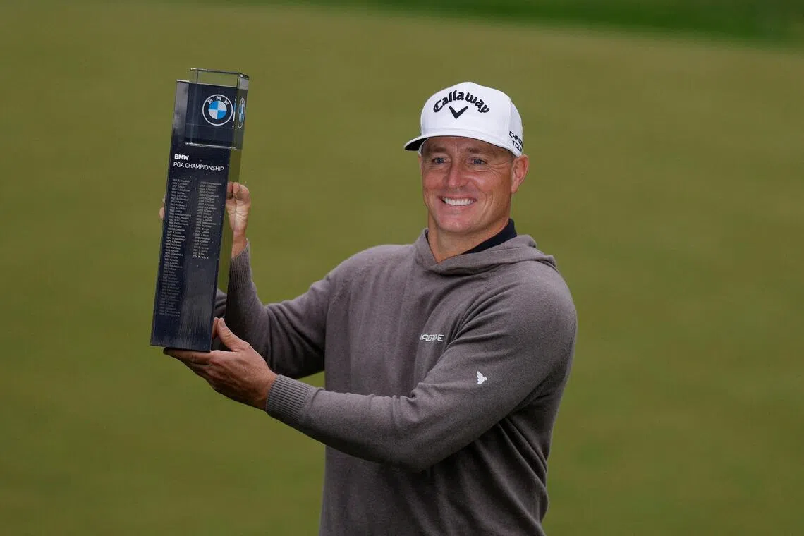 Sweden's Alex Noren celebrating with the trophy after winning the BMW PGA Championship at Wentworth Club, Virginia Water, in Britain on Sept 14, 2025.