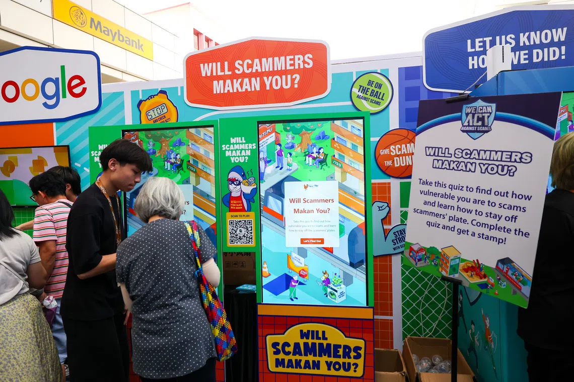 Visitors at the launch of the inaugural National Anti-Scam Roadshow at Toa Payoh HDB Hub Atrium on Nov 8.