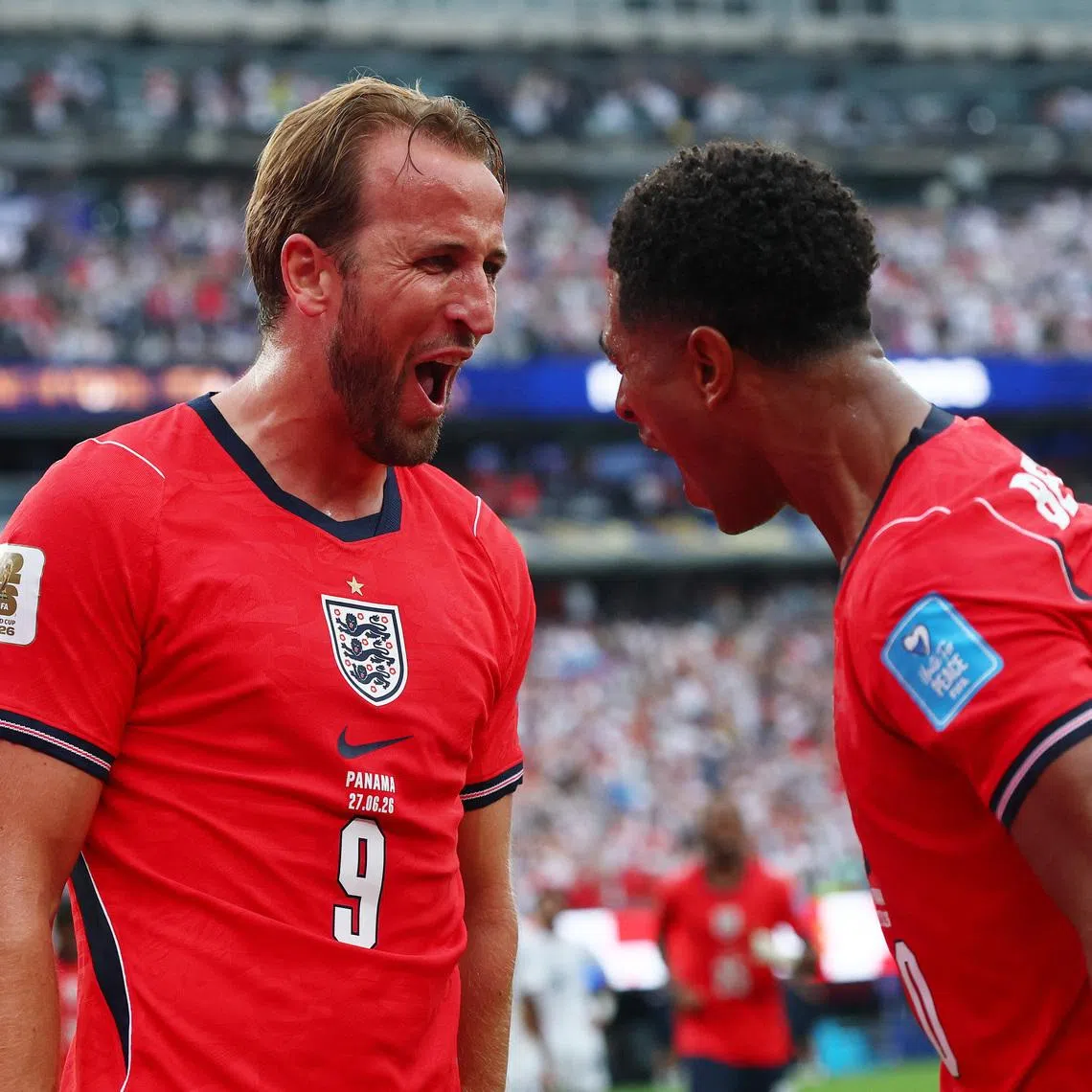 England’s Harry Kane celebrates scoring their second goal with Jude Bellingham, who provided the assist.