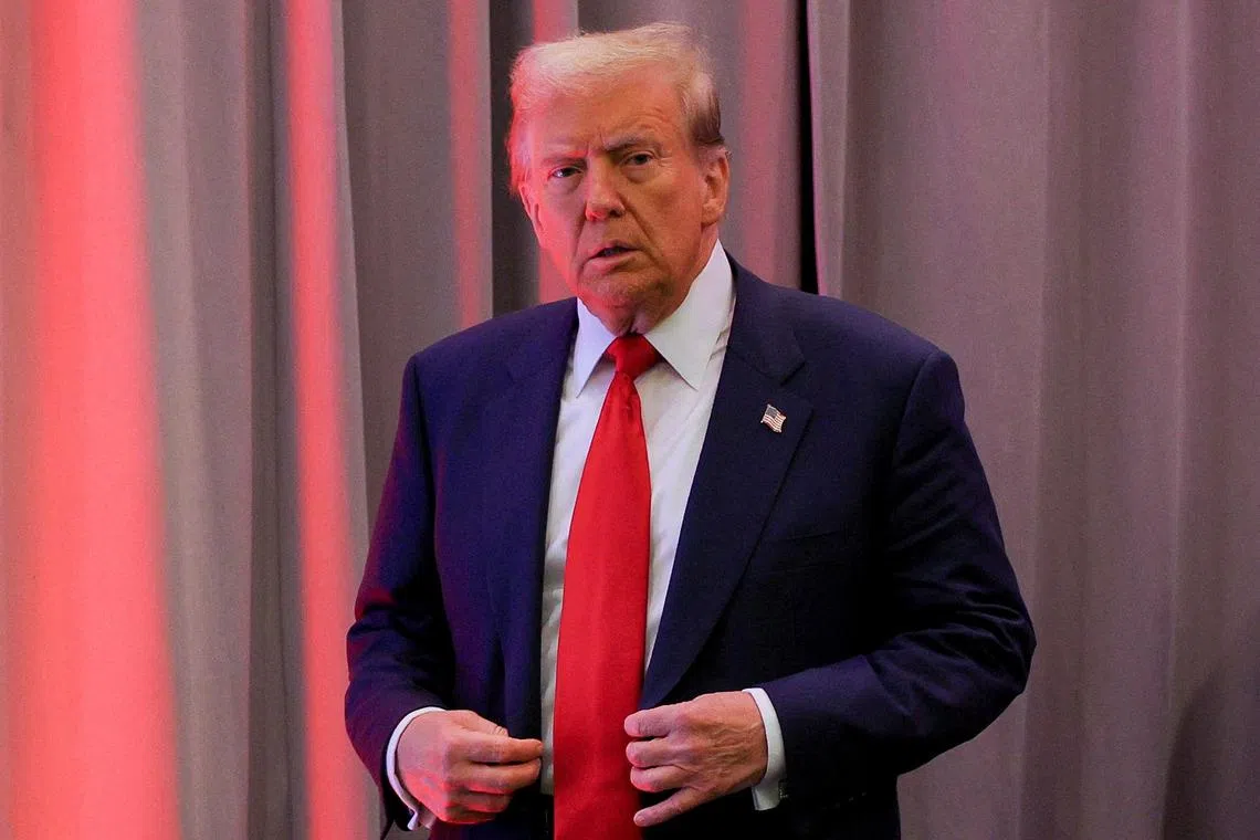 U.S. President-elect Donald Trump looks on as he meets with House Republicans on Capitol Hill in Washington, U.S., November 13, 2024. REUTERS/Brian Snyder/File Photo