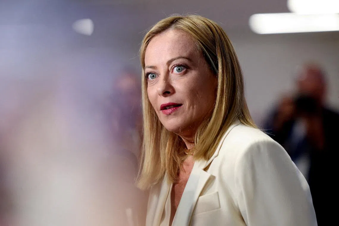 FILE PHOTO: Italian Prime Minister Giorgia Meloni reacts as she speaks to the media at a NATO summit in The Hague, Netherlands June 25, 2025. REUTERS/Claudia Greco/File Photo