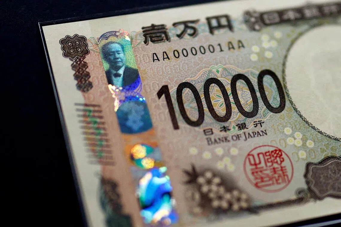 FILE PHOTO: Holograms, which show different images and colours depending on the angle at which they are viewed, are seen on the new Japanese 10,000 yen banknote as the new note is displayed at a currency museum of the Bank of Japan, on the day the new notes of 10,000 yen, 5,000 yen and 1,000 yen went into circulation, in Tokyo, Japan July 3, 2024. REUTERS/Issei Kato/Pool/File Photo