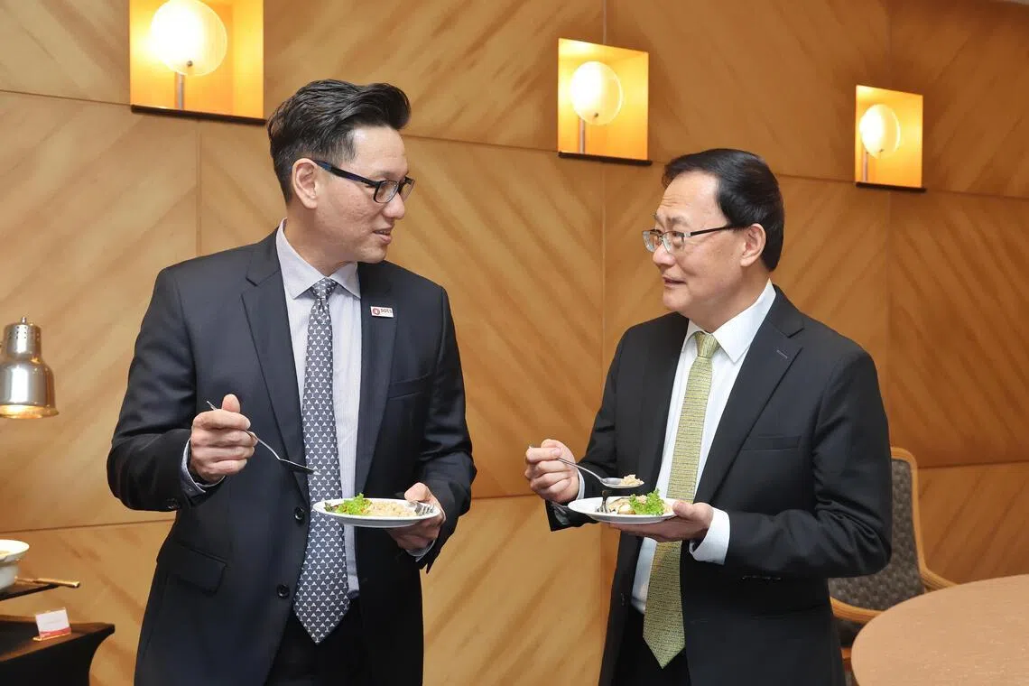 SATS’ president and chief executive Kerry Mok (left) and Temasek Life Sciences Laboratory’s chief executive Peter Chia at the signing of the partnership on June 24.