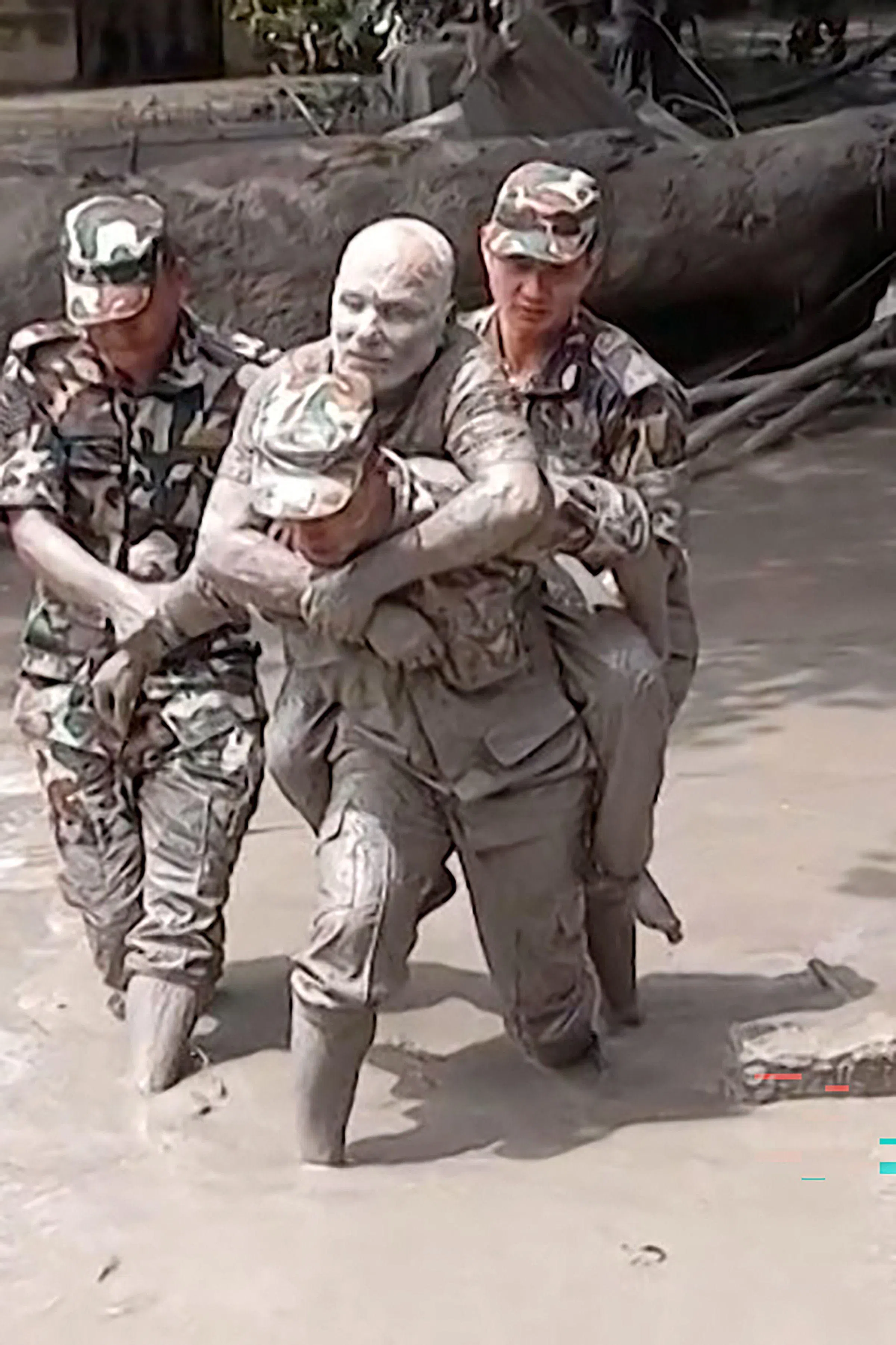 Nepali military personnel rescue a man, in a screengrab from video.