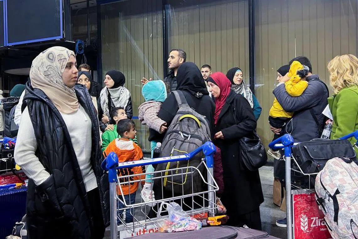 Palestinians holding Bosnian citizenship and their relatives arrive at Sarajevo after having been evacuated to Egypt from Gaza, in Bosnia and Herzegovina, November 20, 2023. REUTERS/Daria Sucic Sito