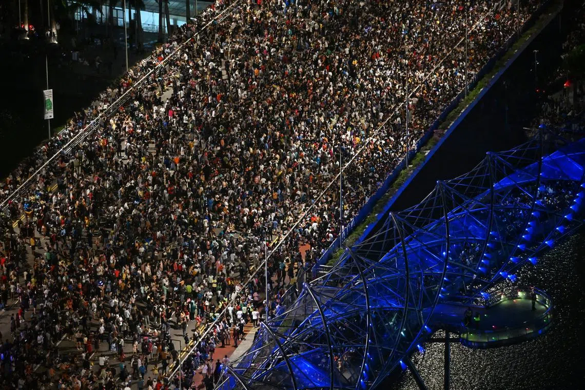 Massive crowds gather in Bayfront Avenue for the Marina Bay Singapore Countdown 2023 on Dec31, 2022