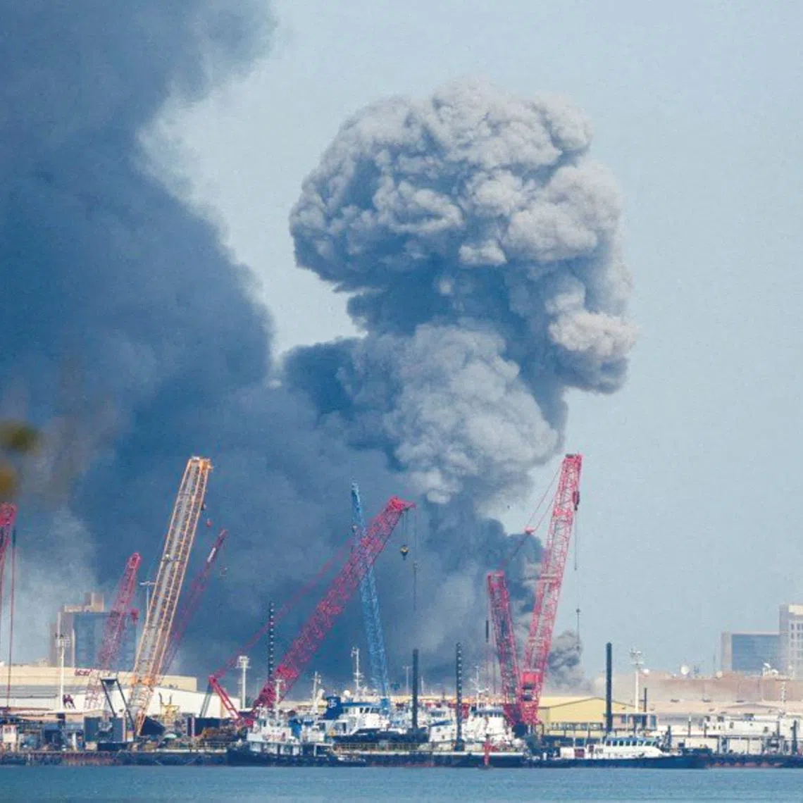 Smoke rises in the sky after blasts were heard in Manama, Bahrain, February 28. REUTERS/Stringer