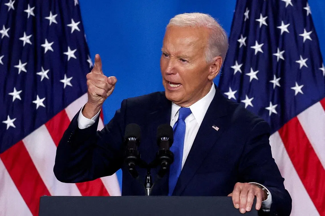 FILE PHOTO: U.S. President Joe Biden gestures as he speaks at a press conference during NATO's 75th anniversary summit, in Washington, U.S., July 11, 2024. REUTERS/Yves Herman/File Photo