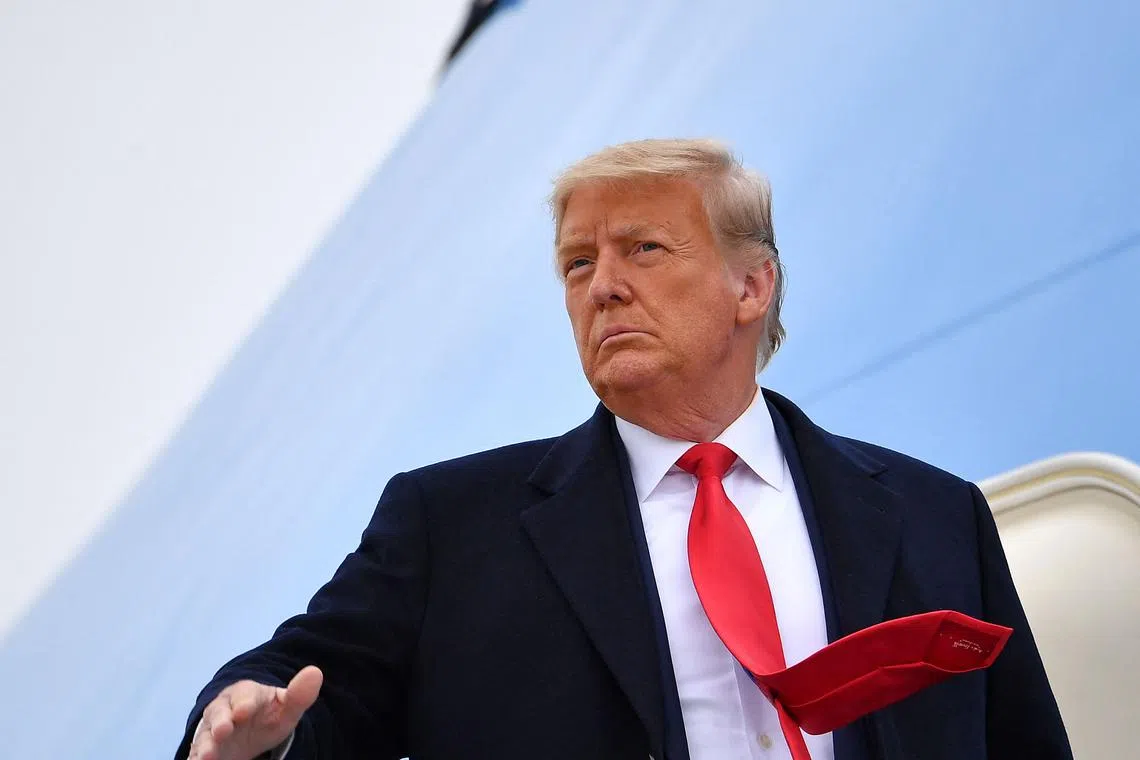 (FILES) US President Donald Trump boards Air Force One before departing Harlingen, Texas on January 12, 2021. Donald Trump once boasted "When you're a star, they let you do it. You can do anything." The dictum he has lived by for decades finally came crashing down on May 30, 2024 when a New York jury told him: no. (Photo by MANDEL NGAN / AFP)