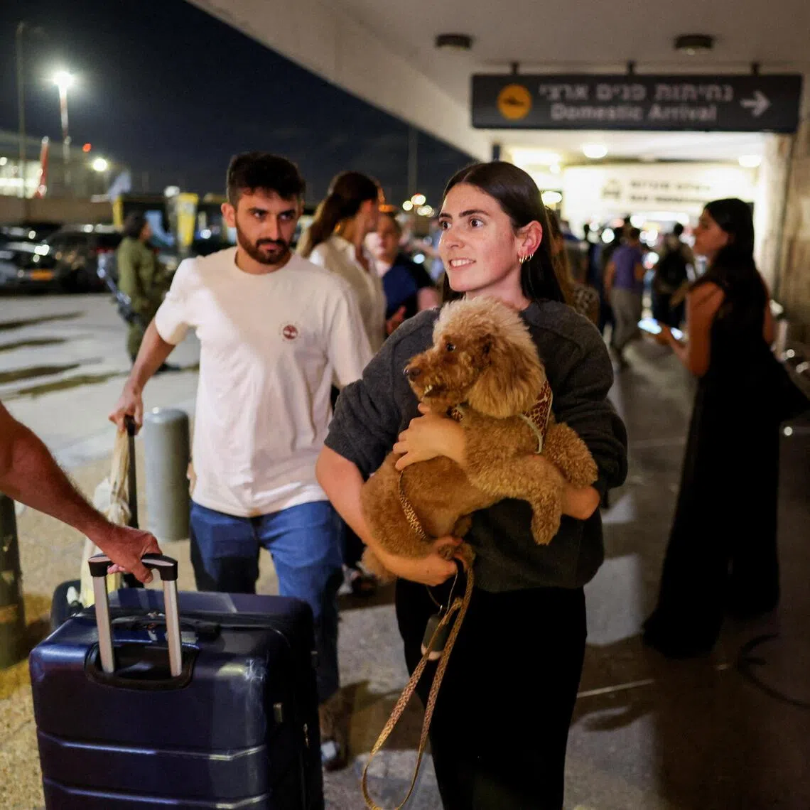 Passengers from flydubai flight FZ1073 arriving back in Israel on Sept 30. A pilot was reportedly stabbed by his co-worker who Israel accused of trying to crash the plane.