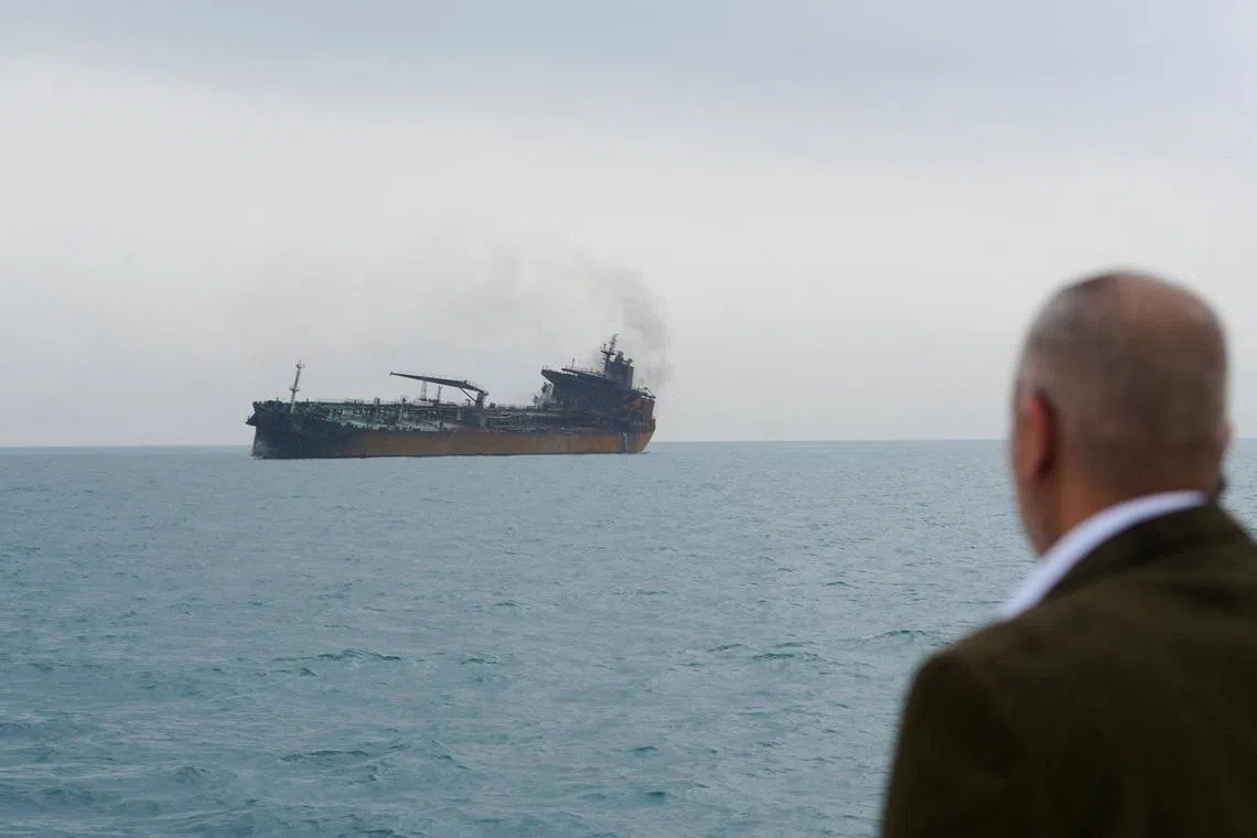 A foreign tanker carrying Iraqi fuel oil damaged after catching fire in Iraq's territorial waters, following unidentified attacks that targeted two foreign tankers, according to Iraqi port officials, near Basra, Iraq, March 12, 2026.