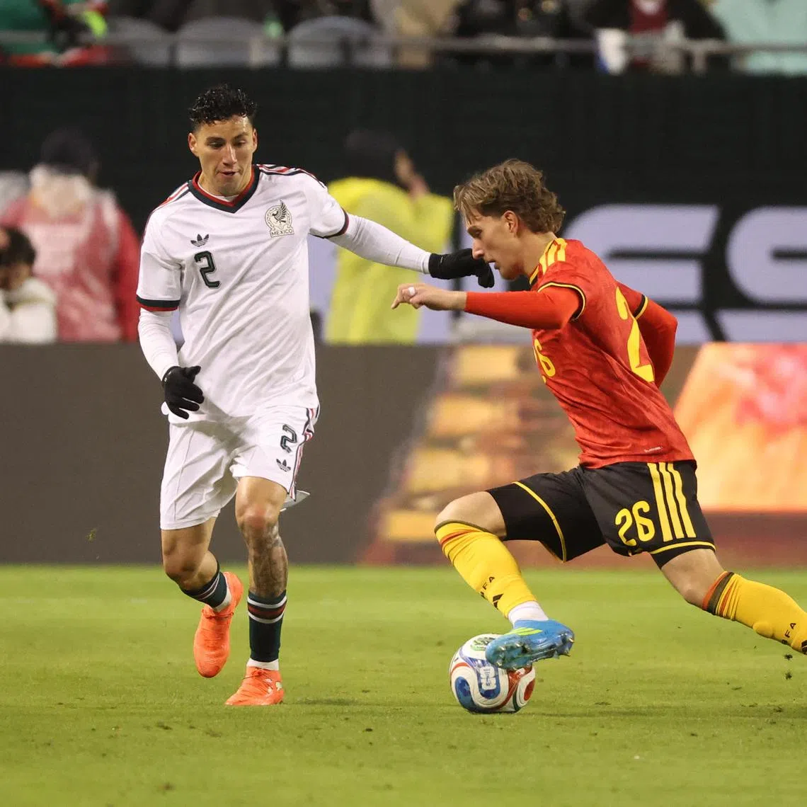 Mar 31, 2026; Chicago, IL, USA; Mexico defender Jorge Sanchez (2) and Belgium forward Mika Godts (26) battle for control of the ball during the first half at Soldier Field. Mandatory Credit: Talia Sprague-Imagn Images