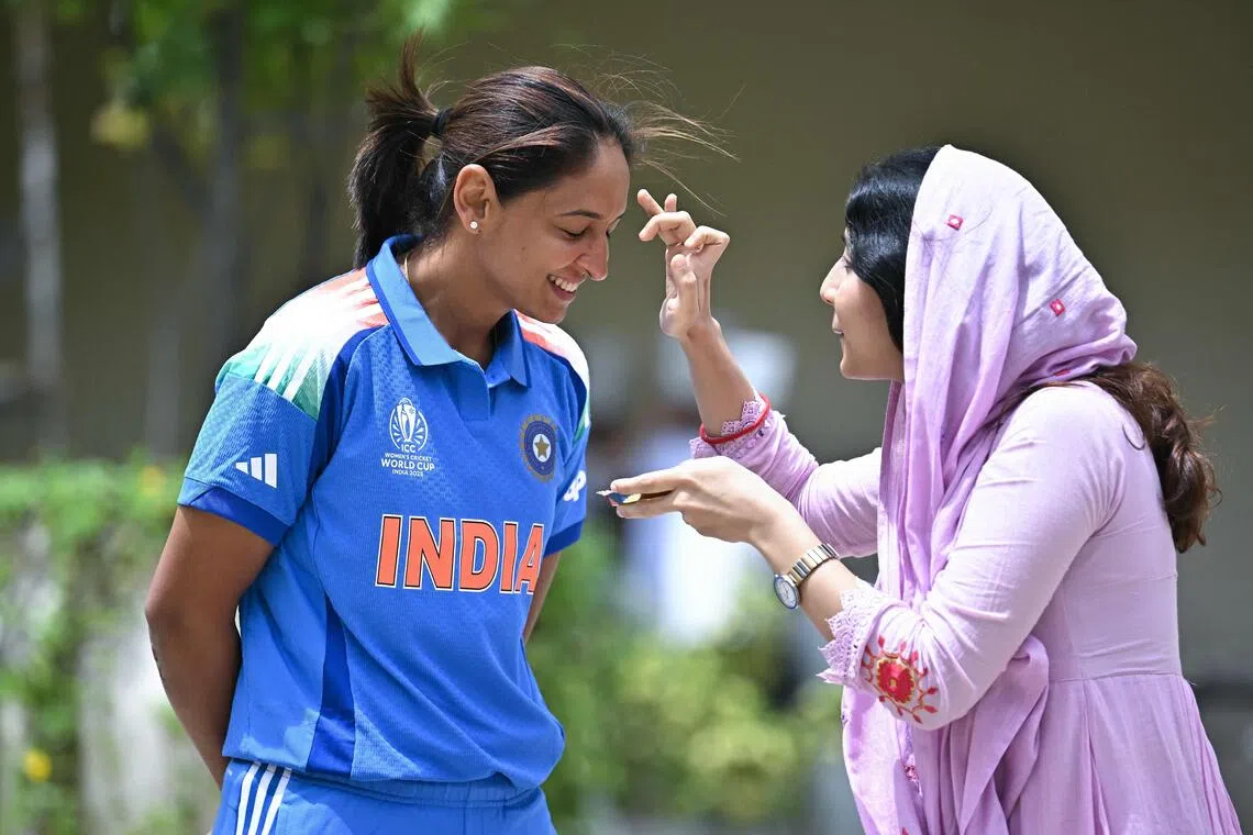 India's captain Harmanpreet Kaur is welcomed ahead of the ICC Women's Cricket World Cup Captains' Day in Bengaluru on Sept 26, 2025. 