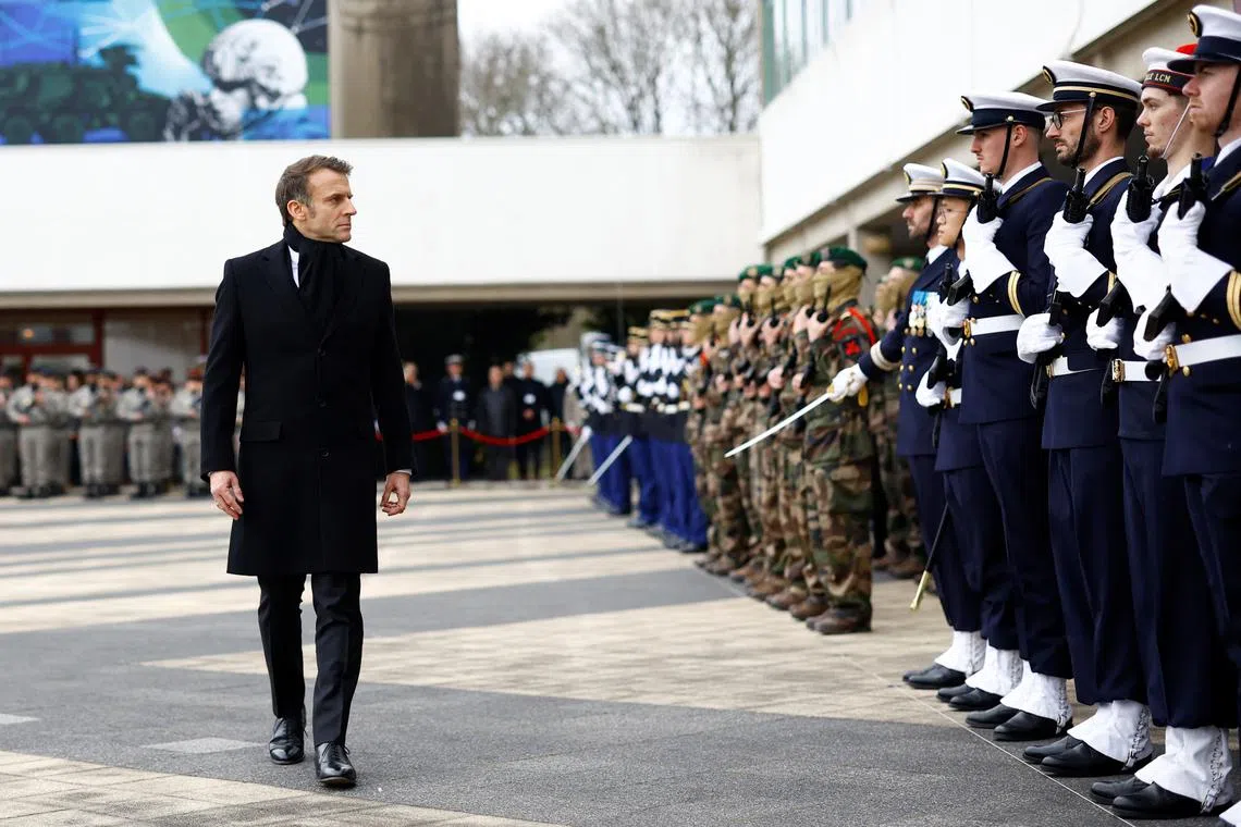 FILE PHOTO: French President Emmanuel Macron reviews troops during a military ceremony in Cesson-Sevigne, near Rennes, France, January 20, 2025. REUTERS/Stephane Mahe/Pool/File Photo