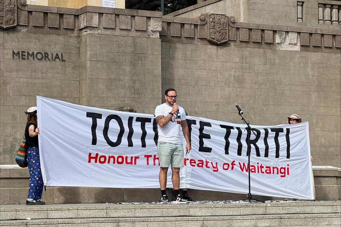 Anaru Ryall speaks at a protest demanding New Zealand's government to honour the Treaty of Waitangi in Wellington, New Zealand, February 6, 2025. REUTERS/Lucy Craymer