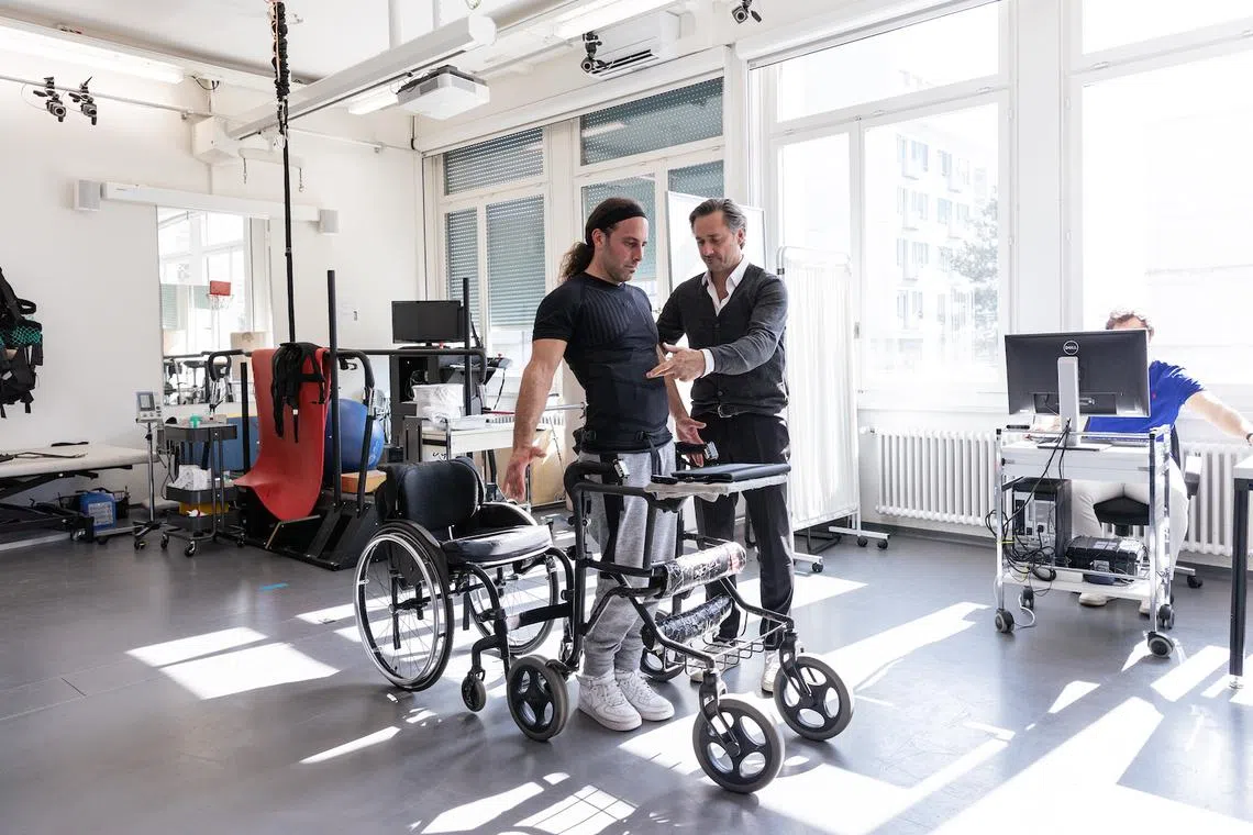French neuroscientist and 2019 Rolex Awards Laureate Gregoire Courtine with patient whose spine has been implanted with the EES
