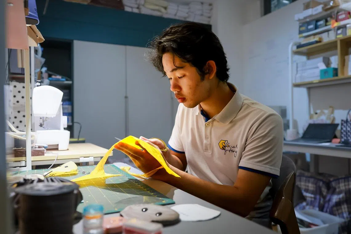 Temasek Polytechnic year three student 
Tang Wen Xi working on his puuches, Aug 24, 2023.
