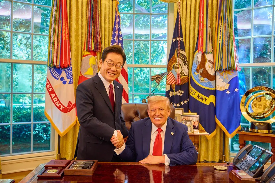 epa12323074 South Korean President Lee Jae Myung (L) shakes hands with US President Donald Trump following their talks in the Oval Office of the White House in Washington, DC, USA, 25 August 2025 (issued 26 August 2025). Lee is on a three day visit to the US.  EPA/YONHAP / POOL SOUTH KOREA OUT
