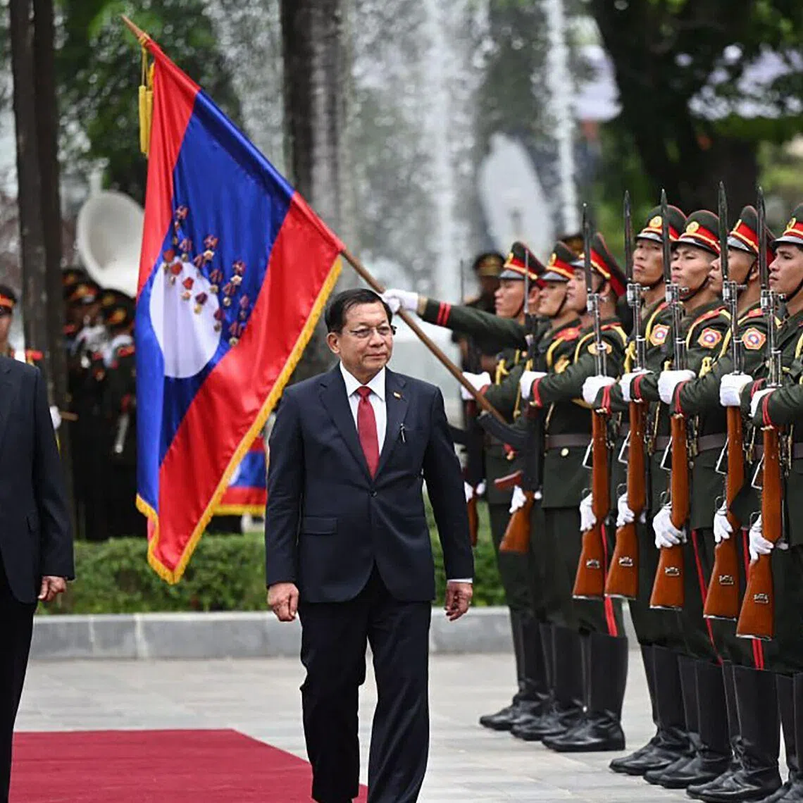 Myanmar President Min Aung Hlaing (right) is making state visits to countries like Laos and China to build an impression that his regime is no longer diplomatically isolated.