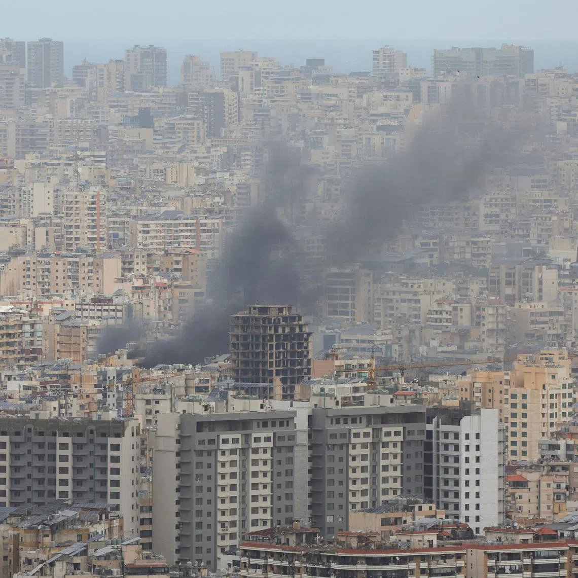 Smoke rises from Beirut's southern suburbs following an Israeli strike, amid escalating hostilities between Israel and Hezbollah, as the U.S.-Israel conflict with Iran continues, Lebanon, March 30, 2026. REUTERS/Adnan Abidi/File Photo