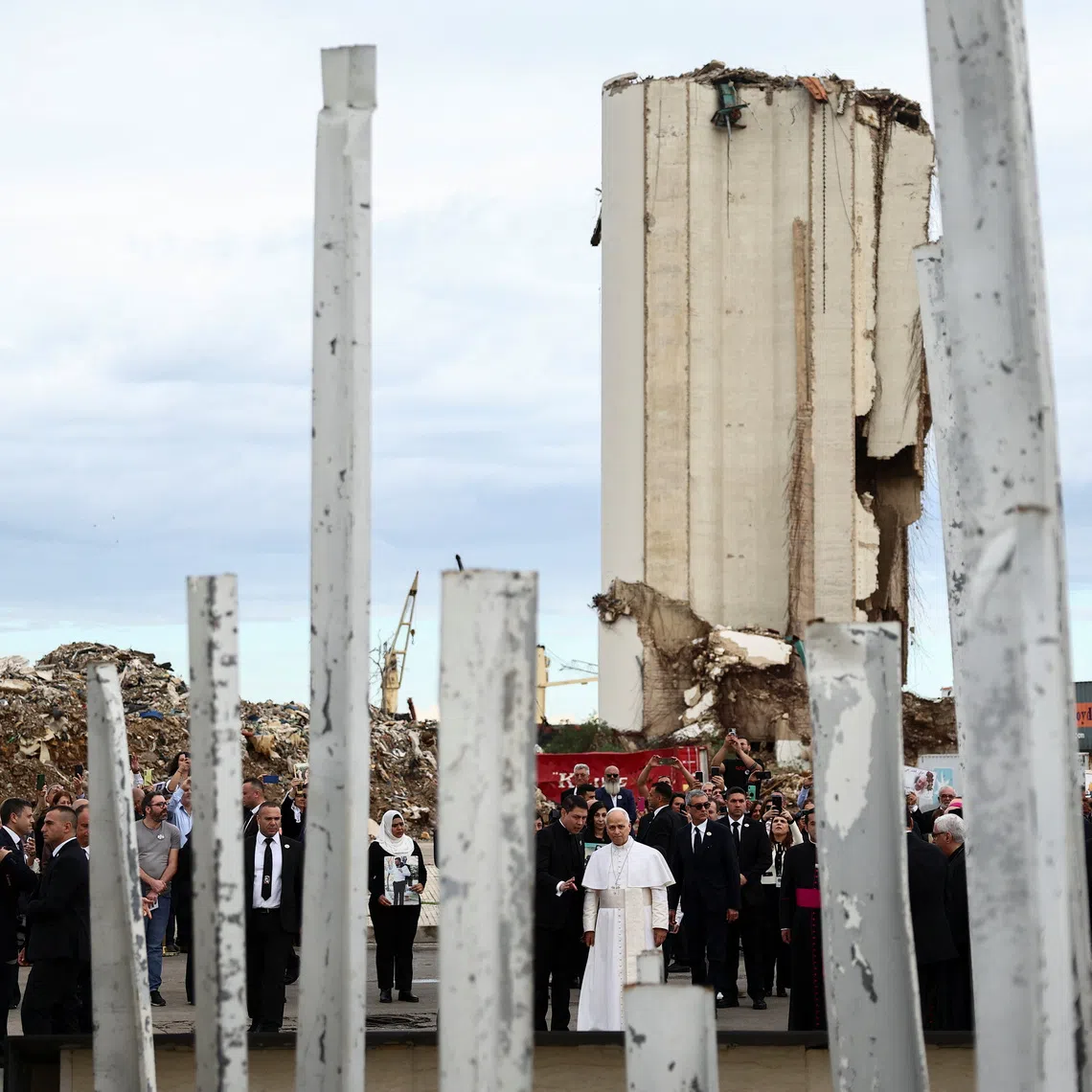Pope Leo XIV holds a silent prayer at the site of the Beirut port blast in August 2020, during his first apostolic journey, in Beirut, Lebanon December 2, 2025. REUTERS/Yara Nardi/Pool