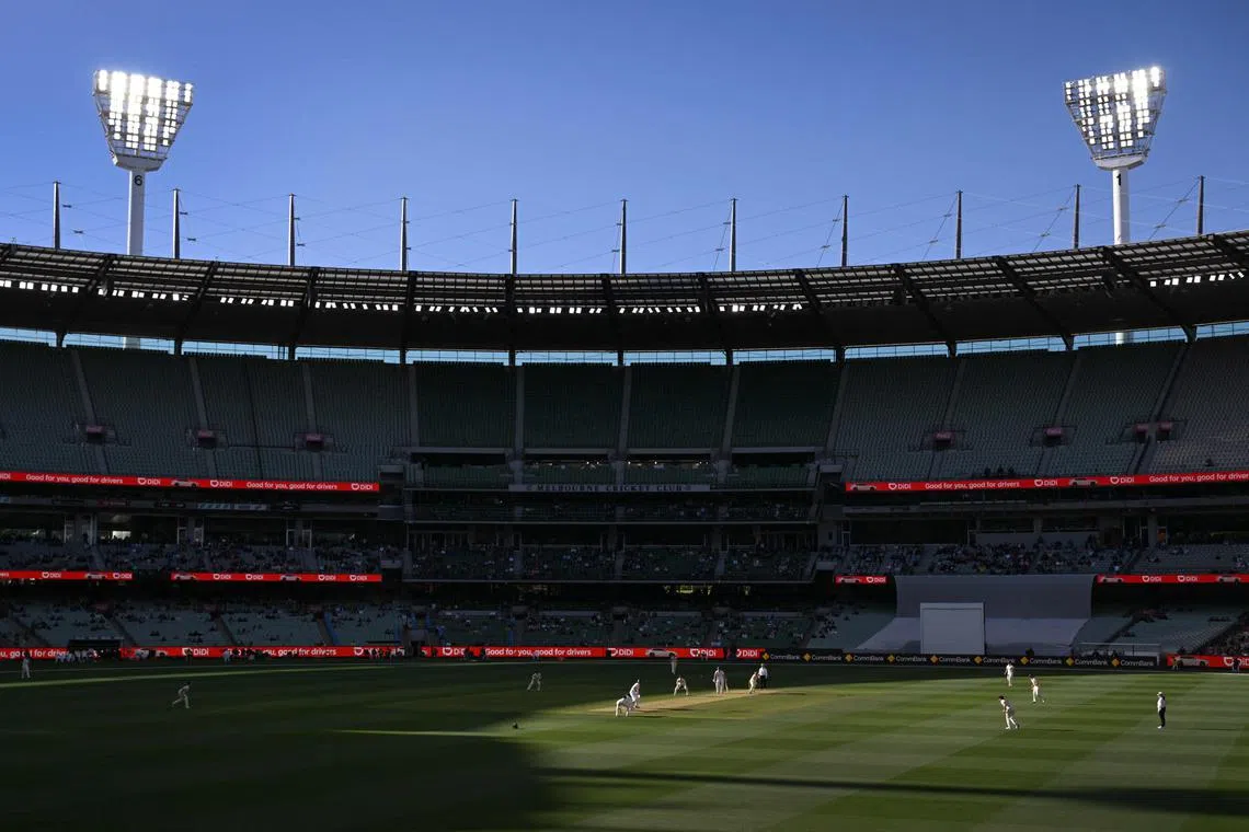 Two men refused refused to leave the MCG over their behaviour and were arrested and later charged with firearms possession and other offences.