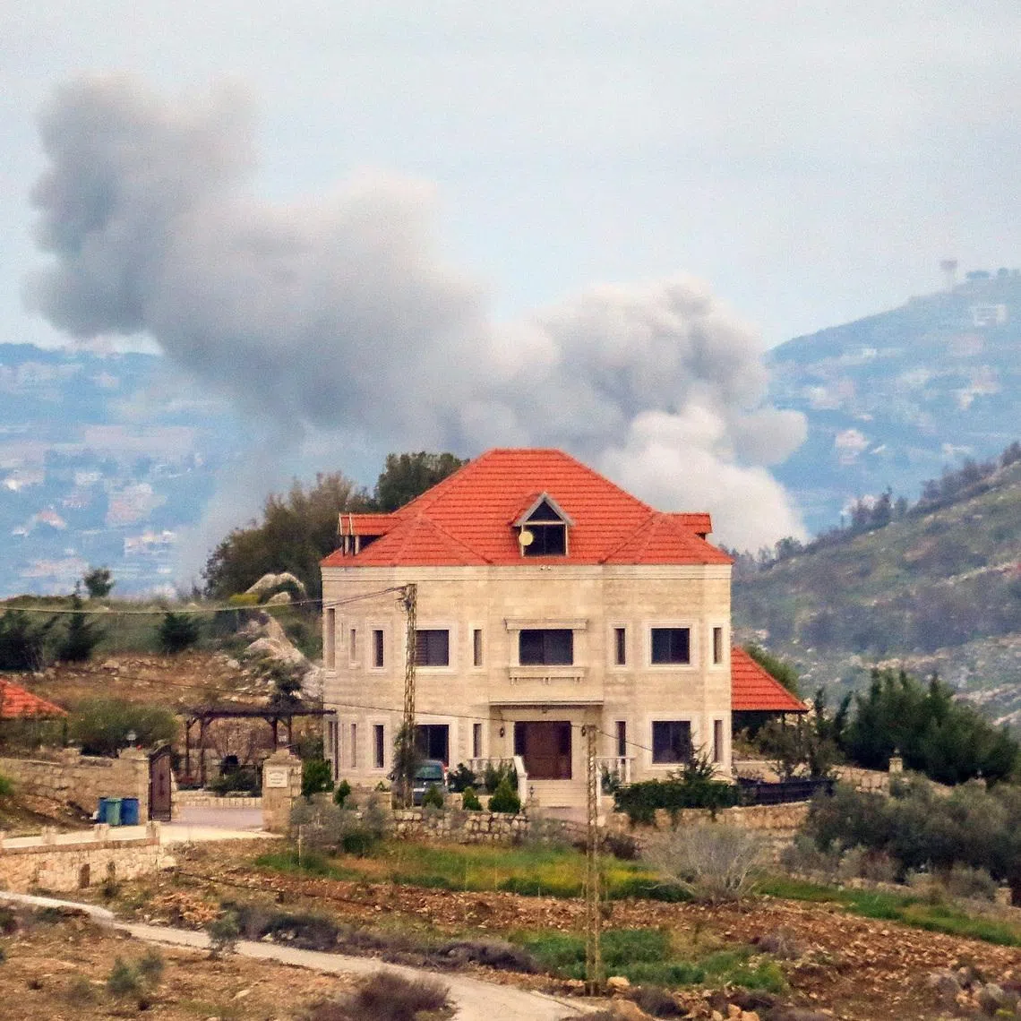 Smoke rises after an Israeli strike, amid escalating hostilities between Israel and Hezbollah, as the U.S.-Israeli conflict with Iran continues, in southern Lebanon, March 25, 2026. REUTERS/Stringer