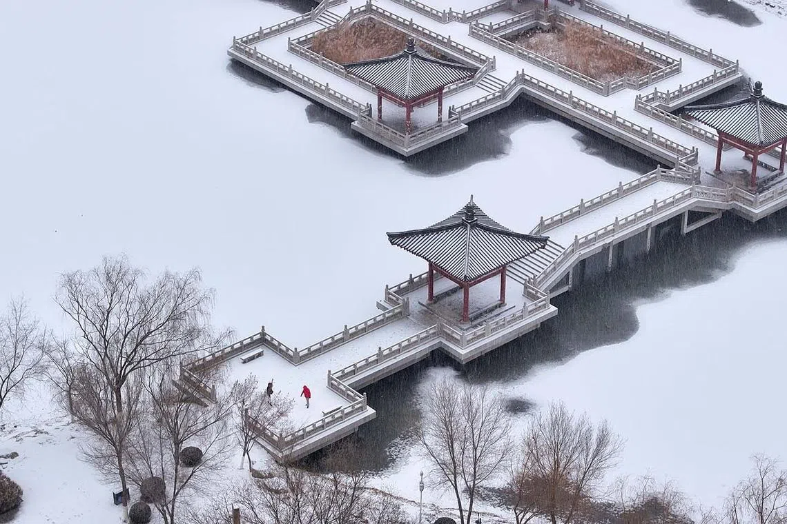 An aerial photo showing the snow-covered Haibao park in Yinchuan, China, Dec 14, 2023. 