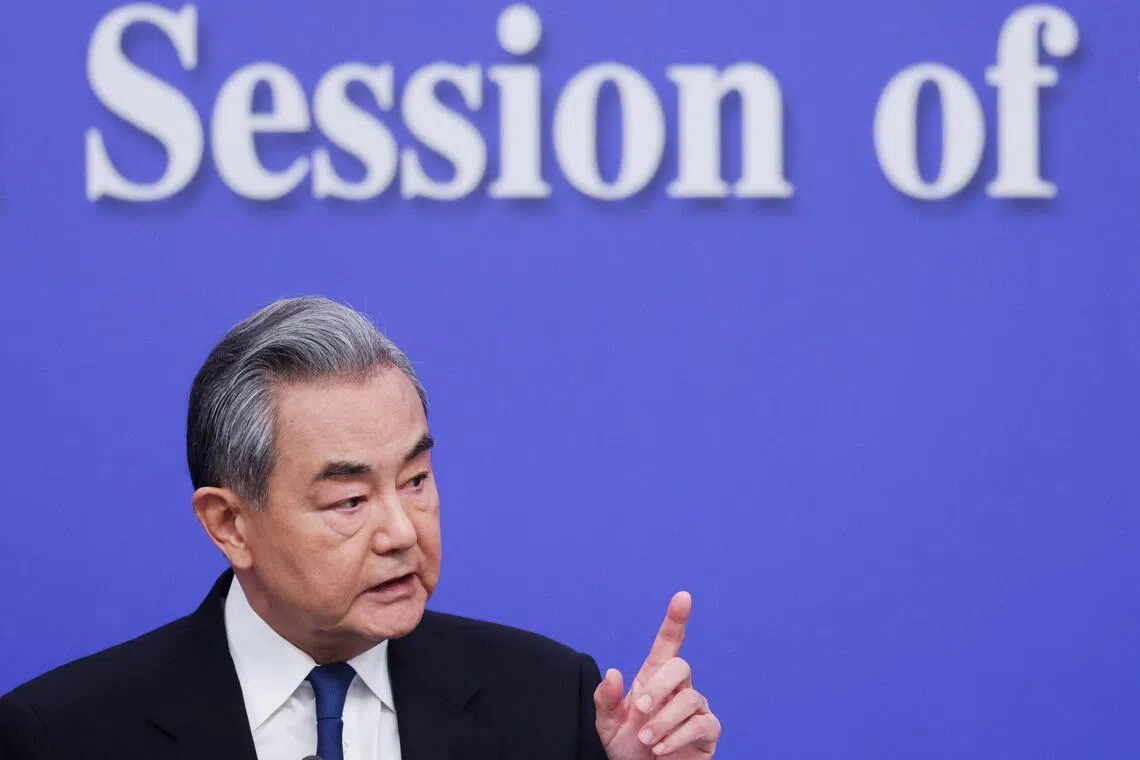 Chinese Foreign Minister Wang Yi attends a press conference on the sidelines of the National People's Congress (NPC), in Beijing, China, March 8, 2026. REUTERS/Maxim Shemetov