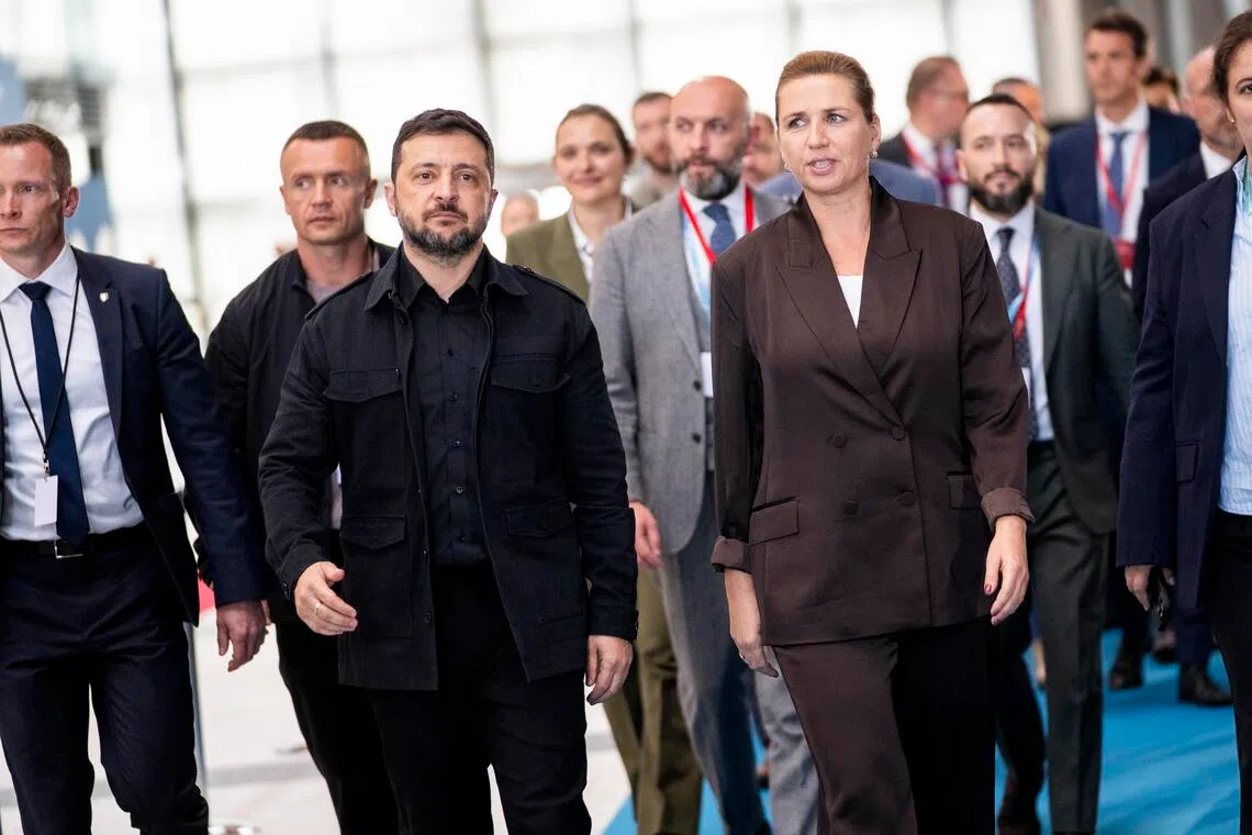 Danish Prime Minister Mette Frederiksen (right) and Ukrainian President Volodymyr Zelensky (left) arriving for a joint press conference in Copenhagen on Oct 2.