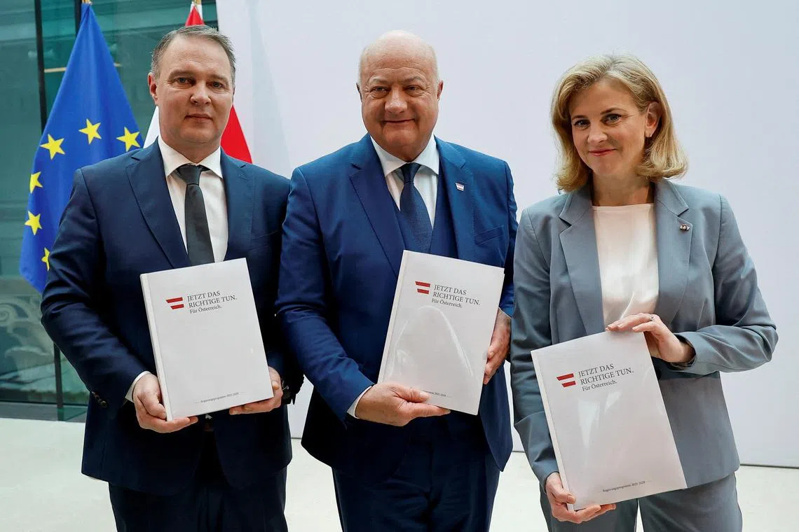 (From left) Social Democrats head Andreas Babler, People's Party head Christian Stocker and Neos party head Beate Meinl-Reisinger pose in Vienna on Feb 27 after finalising coalition talks.  