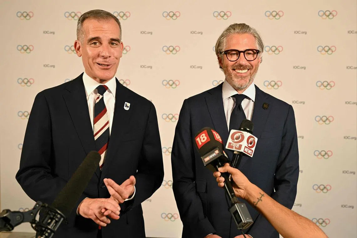 United States Ambassador to the Republic of India, Eric Garcetti (left) speaking to the media as Chairman of LA 2028 Olympic Games, Casey Wasserman, looks on during the second day of the 141st International Olympic Committee (IOC) session in Mumbai on Monday.