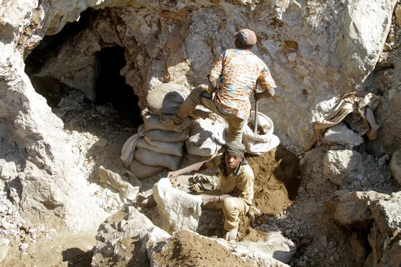 Artisanal miners work at the Tilwezembe, a former industrial copper-cobalt mine, near Kolwezi, the capital of the Lualaba Province in the Democratic Republic of the Congo.