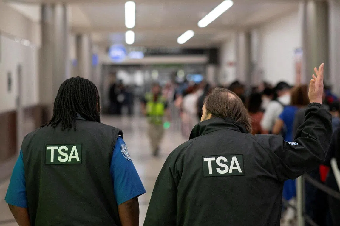 Transportation Security Administration (TSA) officers walk through the domestic terminal at Hartsfield-Jackson Atlanta International Airport in Atlanta, Georgia, U.S. March 27, 2026. REUTERS/Alyssa Pointer