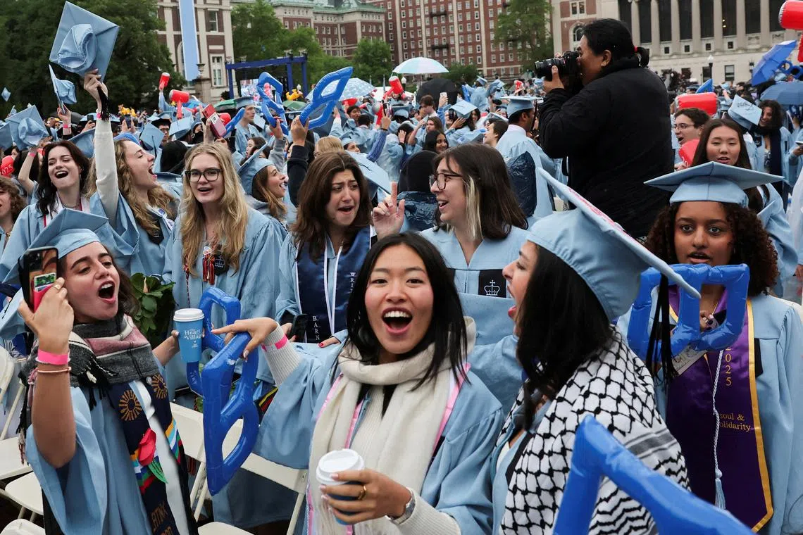 FILE PHOTO: Students attend Columbia University commencement ceremony on Columbia's main campus, in Manhattan, New York City, U.S., May 21, 2025. REUTERS/Jeenah Moon/Pool/File Photo