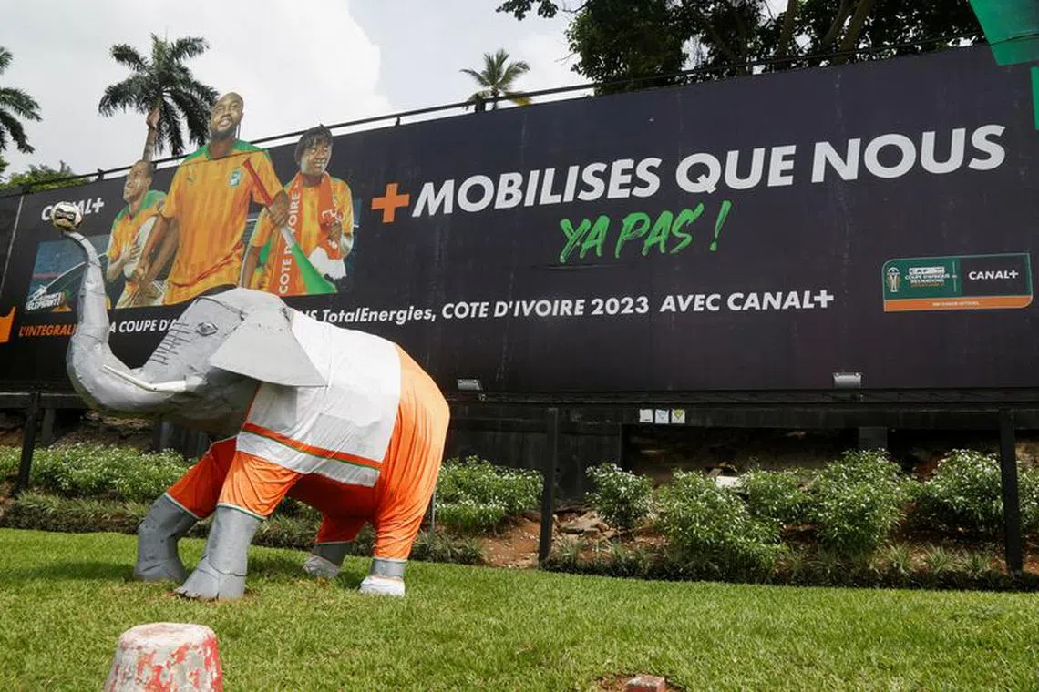 FILE PHOTO: A billboard reads \"More mobilized than us there are none\", as Ivory Coast gears up to host the Africa Cup of Nations which begins on Saturday in Abidjan, Ivory Coast January 4, 2024. REUTERS/Luc Gnago/File Photo