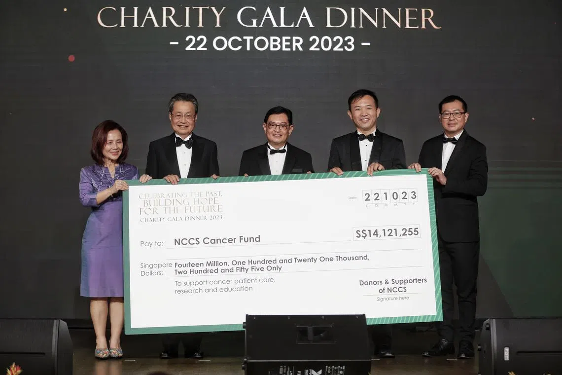 DPM Heng Swee Keat (centre) at the cheque presentation with (from left) NCCS Cancer Fund chairwoman Ho Geok Choo, SingHealth chairman Cheng Wai Keun, NCCS CEO William Hwang and deputy CEO Lim Soon Thye.