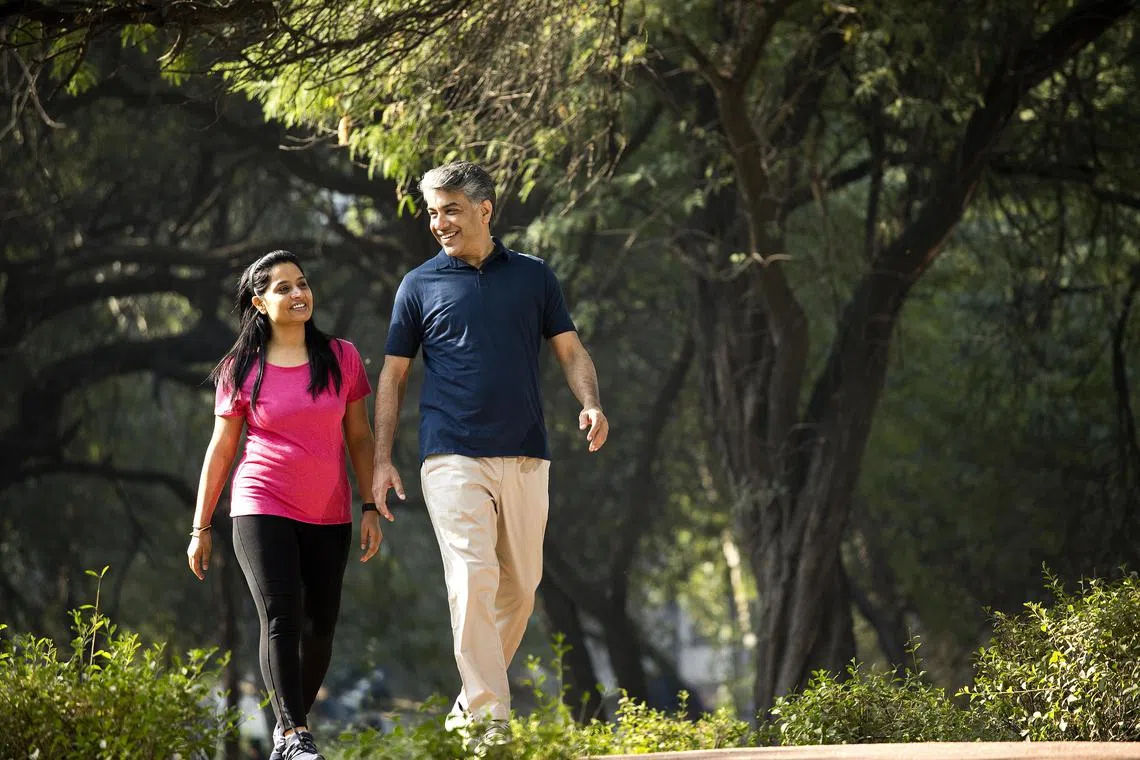 Experts say that planning walks or exercise activities with loved ones will help you stay accountable and hit your activity goals.