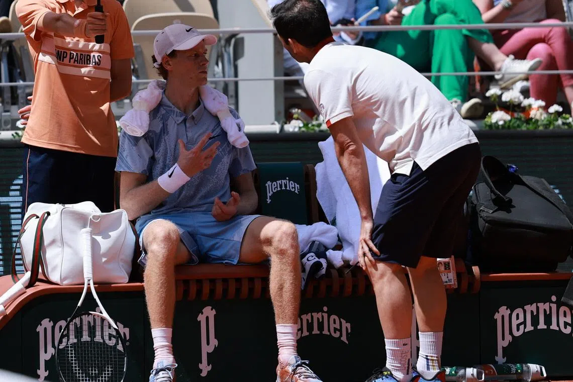 Tennis - French Open - Roland Garros, Paris, France - May 28, 2026 Italy's Jannik Sinner receives medical attention during his second round match against Argentina's Juan Manuel Cerundolo REUTERS/Stephanie Lecocq