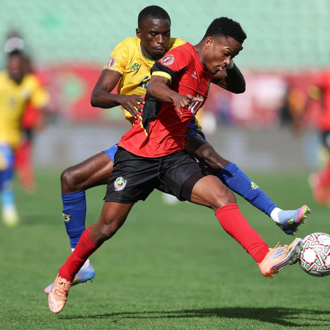 Gabon defender Mick Kila Omfia trying to dispossess Mozambique midfielder Geny Catamo in their Africa Cup of Nations Group F football match at Grand Stadium in Agadir on Dec 28, 2025.