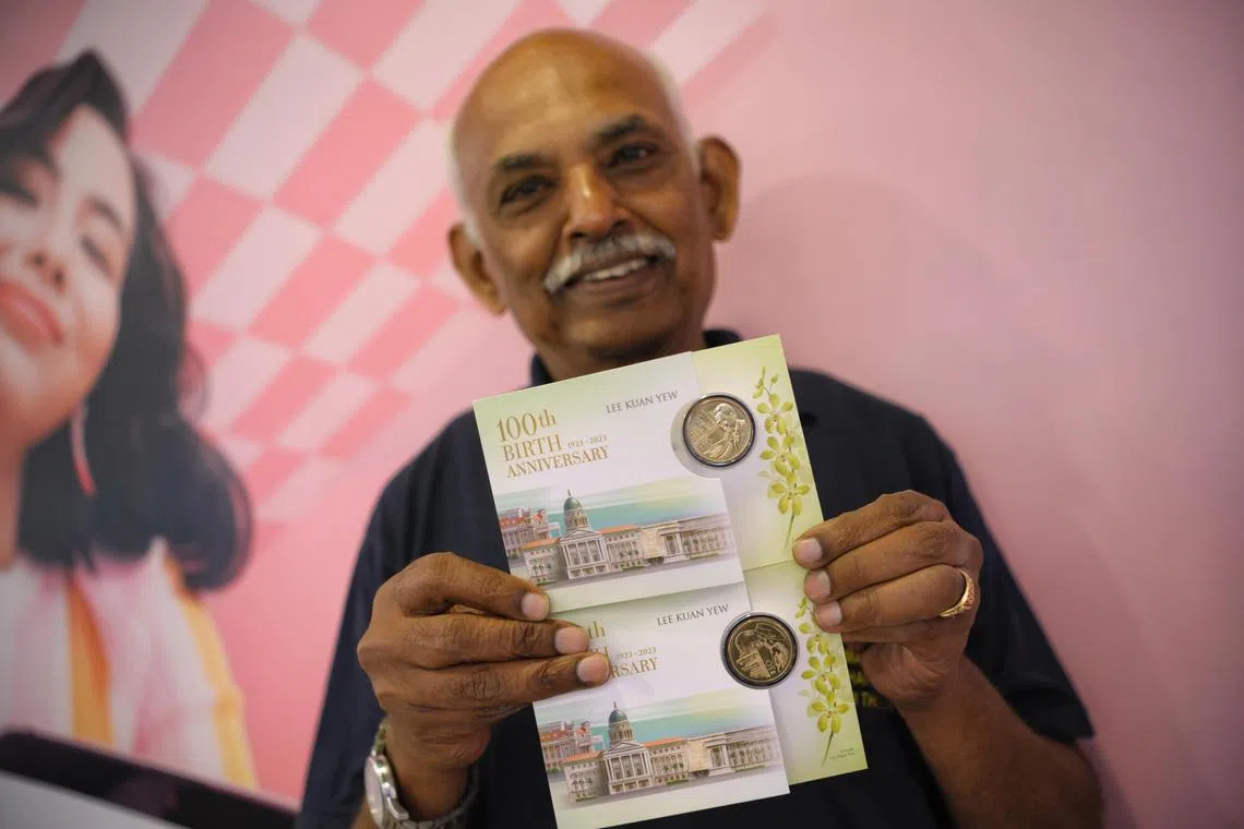 Andiappan, 72, a Singaporean PR,  displays two of eight LKY100 coins which be managed to exchange at a DBS branch at Plaza Singapura on Dec 4, 2023.