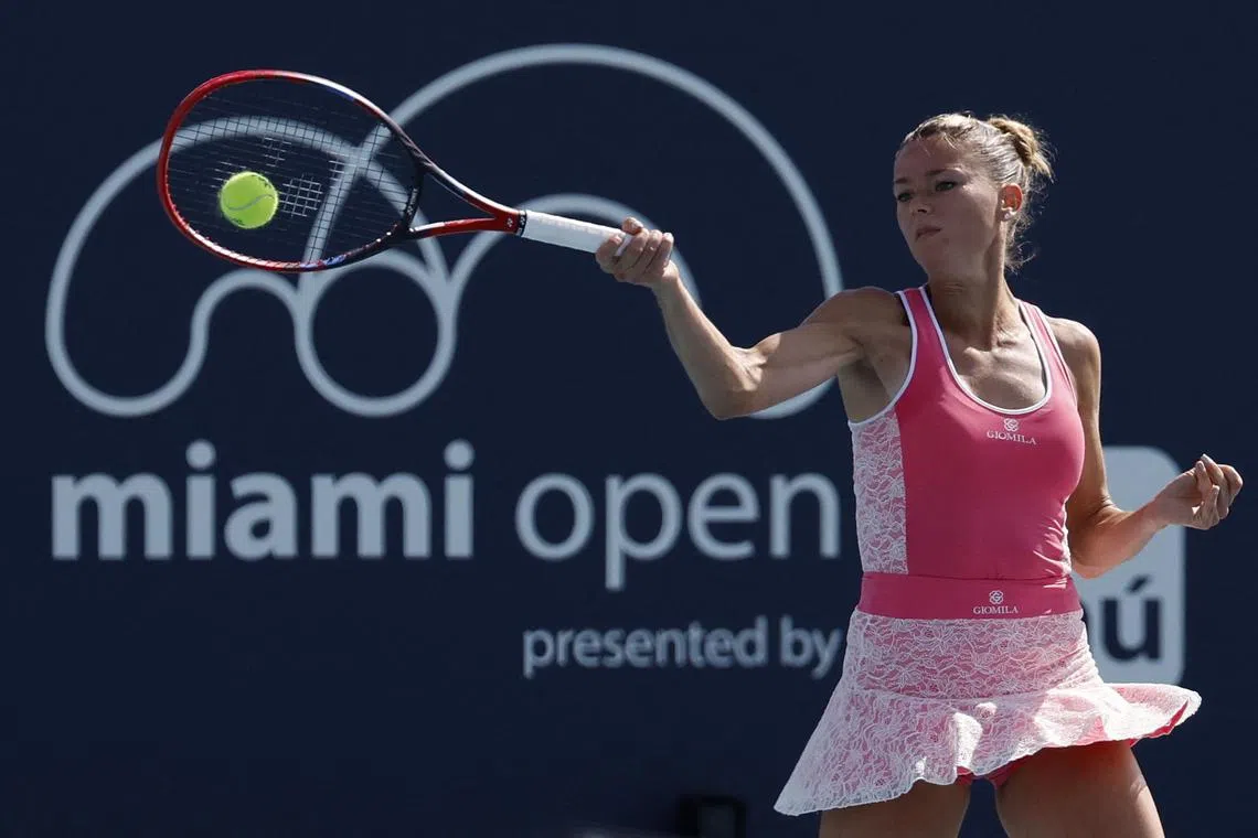 Italy's Camila Giorgi hitting a forehand against Estonia's Kaia Kanepi (EST) at the Miami Open at Hard Rock Stadium. 