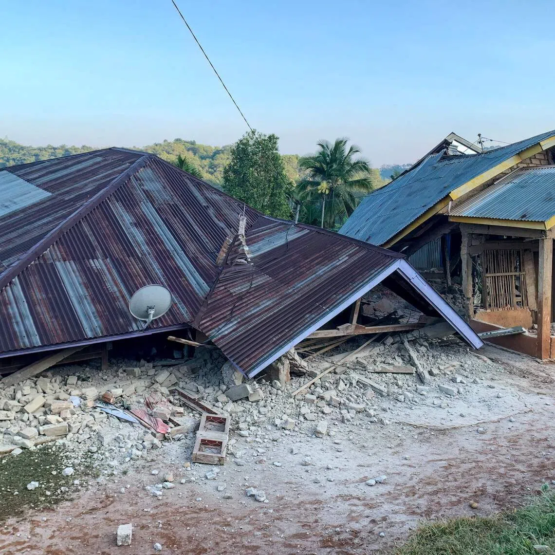 Damaged houses are seen following a 7.7-magnitude earthquake in Ruteng, Manggarai, East Nusa Tenggara, on Aug 15.