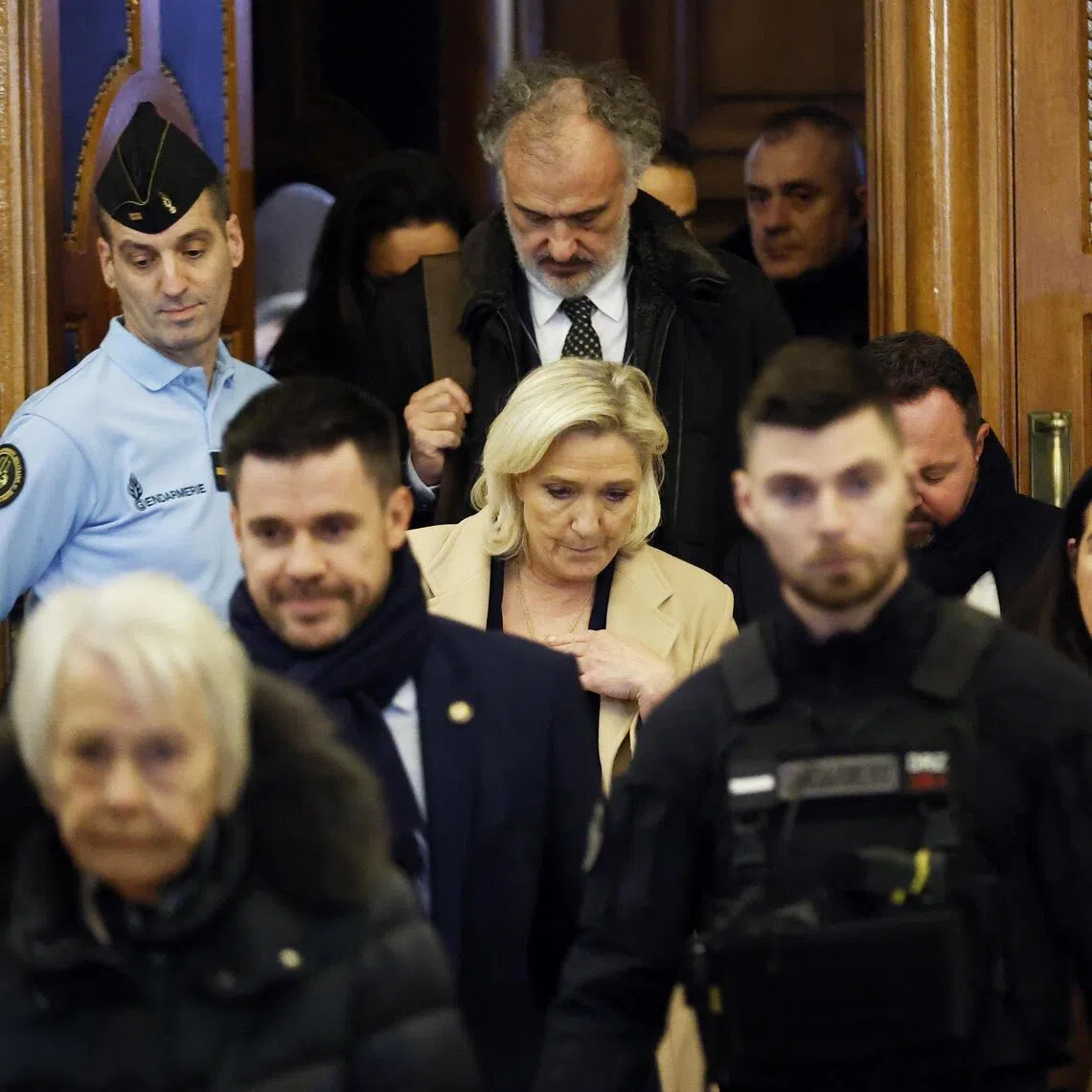 French far-right leader Marine Le Pen (centre) leaving her appeal hearing on Jan 13. If the court upholds the first ruling, she will be prevented from running in the 2027 presidential election.
