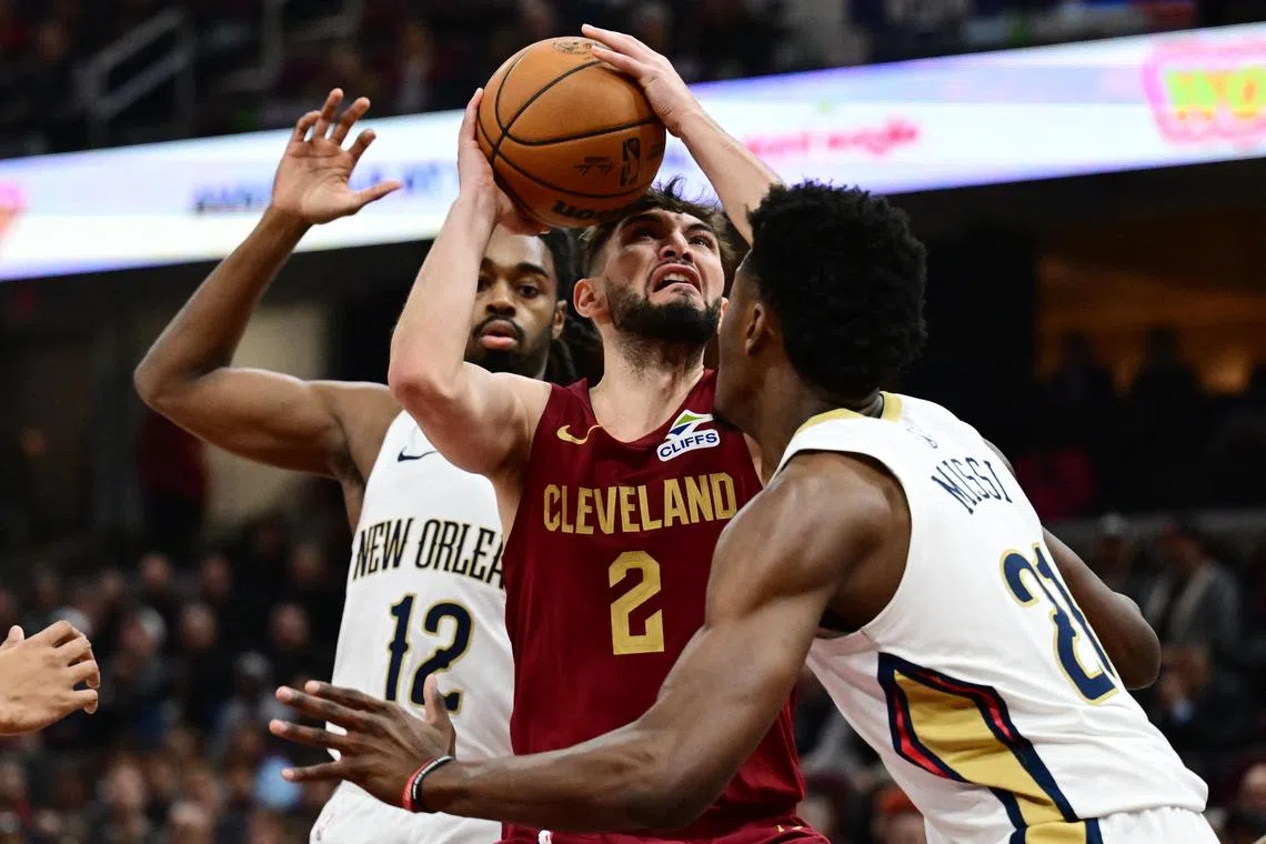 Cleveland Cavaliers guard Ty Jerome drives to the basket during the first half at Rocket Mortgage FieldHouse.