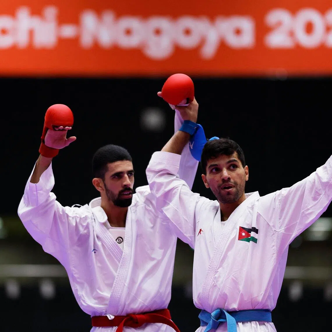 Palestine’s Mahmoud Daifallah (left) and Jordan’s Abdel Rahman Almasatfa won their bronze-medal bout in the men’s karate 67kg kumite at the Aichi-Nagoya Asian Games on Sept 21.