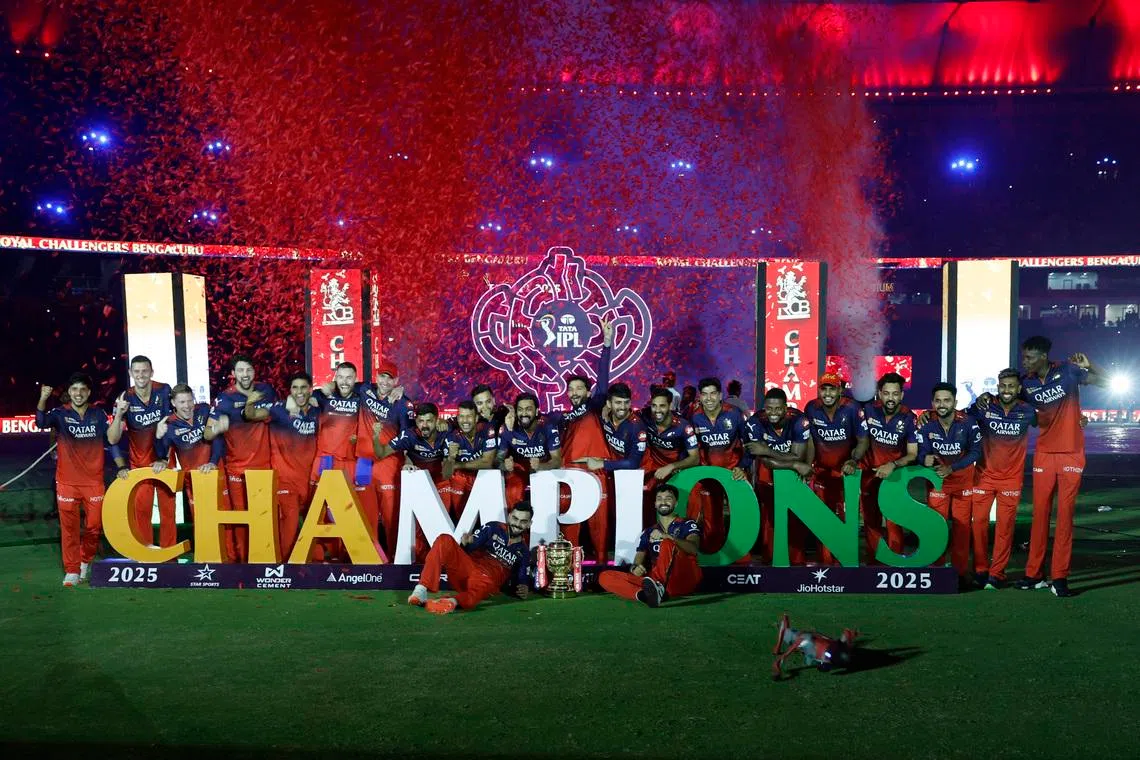 FILE PHOTO: Cricket - Indian Premier League - IPL - Final - Royal Challengers Bengaluru v Punjab Kings - Narendra Modi Stadium, Ahmedabad, India - June 4, 2025 Royal Challengers Bengaluru players celebrate with the trophy after winning the Indian Premier League REUTERS/Amit Dave/File Photo
