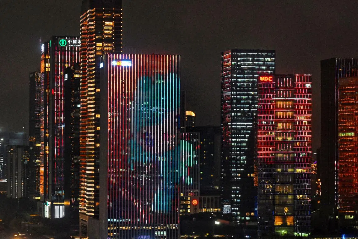 A projection of the games mascot on the skyscrapers is seen during the opening ceremony of the 19th Asian Games Hangzhou 2022 on Sept 23.